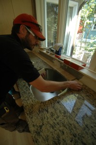 Dan is doing a dry-layout of the tile for the backsplash to see how it lines up