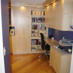 The office zone of the room is at the foot of where the bed sits when it isn't folded away. Instead of metal file cabinets, there are beautiful maple file cabinets featured on the right. 