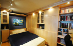 cozy bedroom with custom built in shelves by nedc