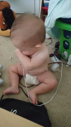 My son, eating my phone charger.