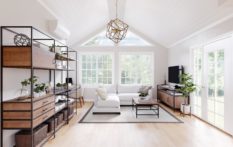 bright white living room with angled ceiling and windows to ceiling