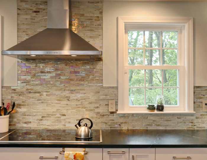 backsplash kitchen tile with a luxurious range hood
