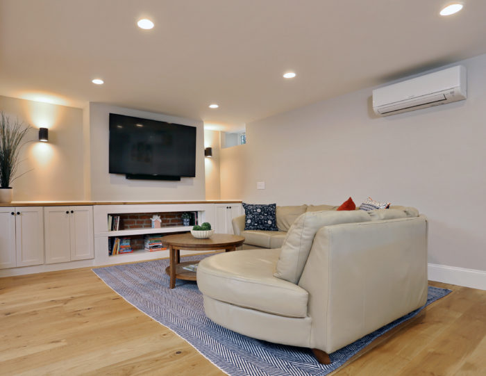 basement remodel with luxurious couch