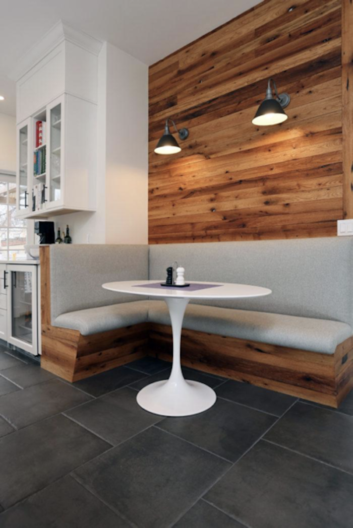 l shaped booth with a round table in custom kitchen