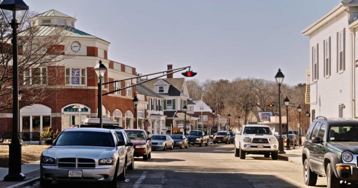 city street in Massachusetts with cars parked on the side of the road