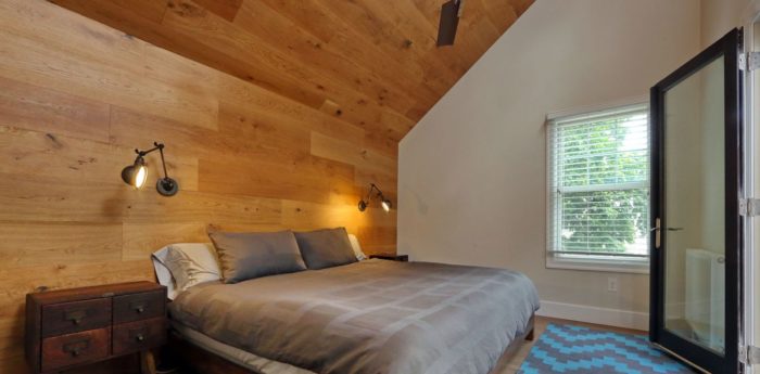 attic bedroom addition wood wall in boston remodel