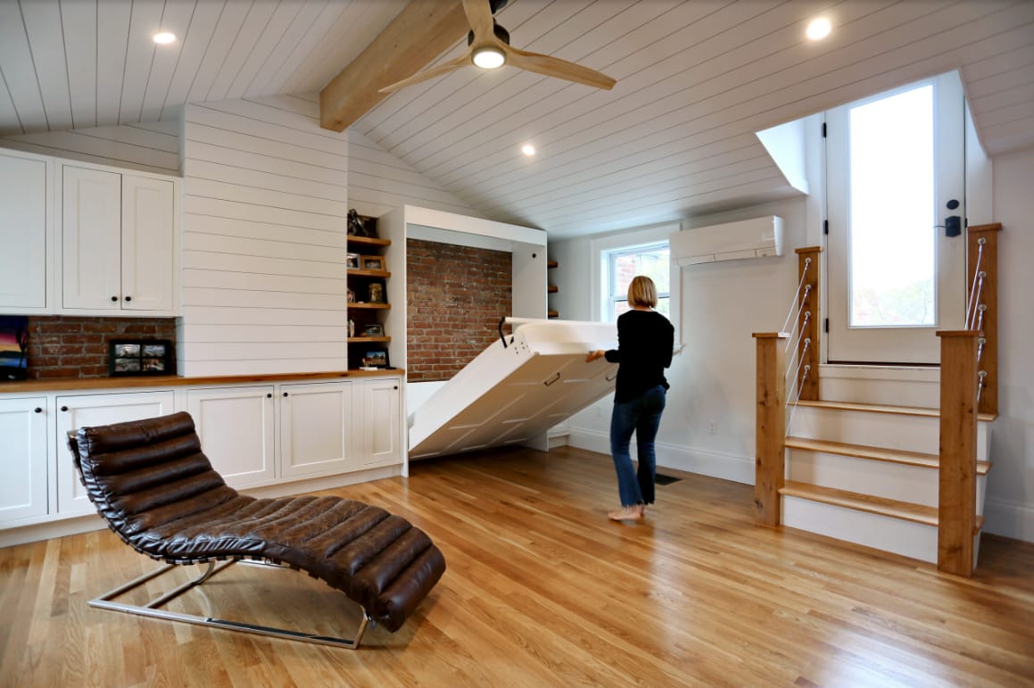 Attic space becomes a bedroom with Murphy bed install and refinish by New England design and construction